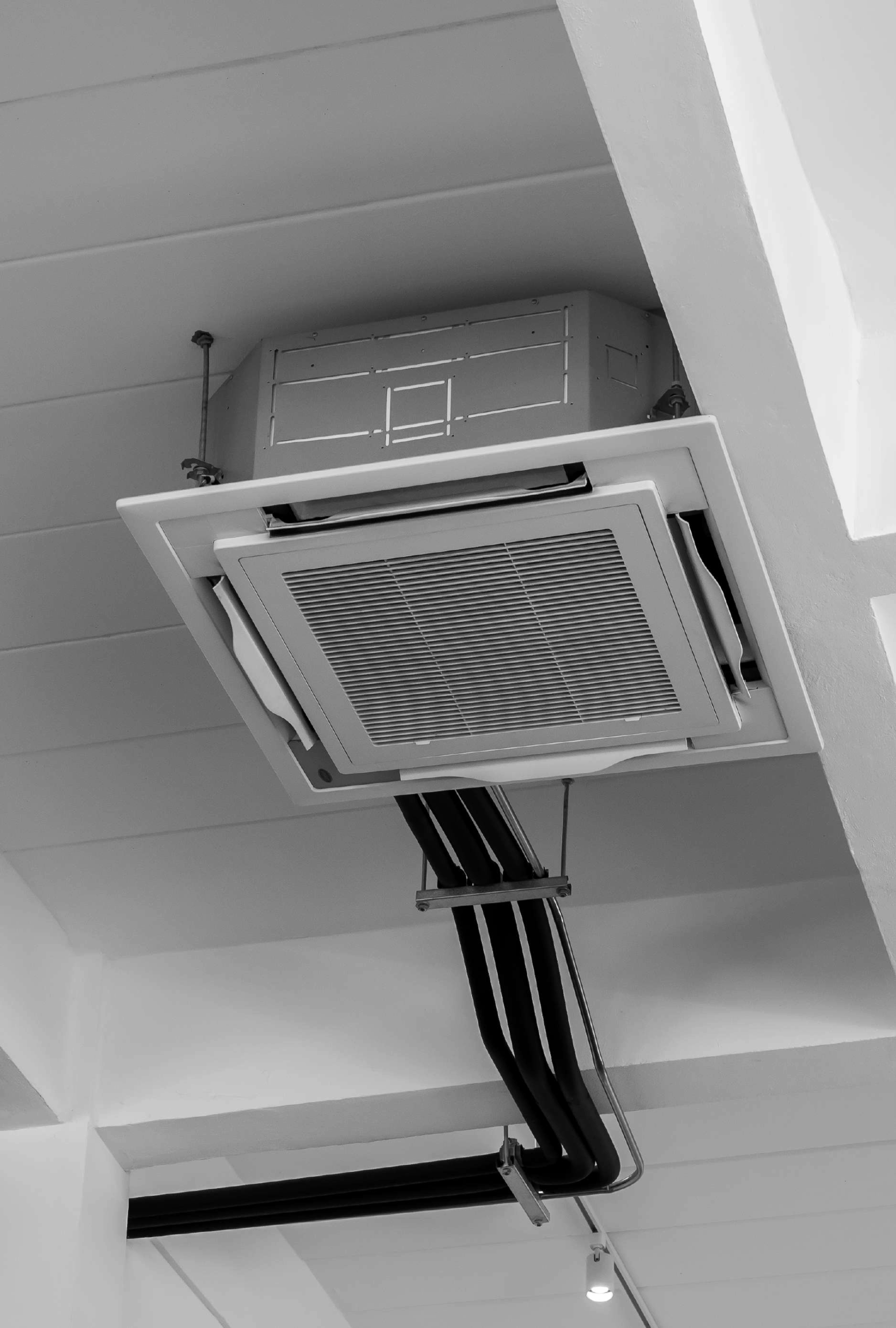Ceiling-mounted air conditioning unit installation.