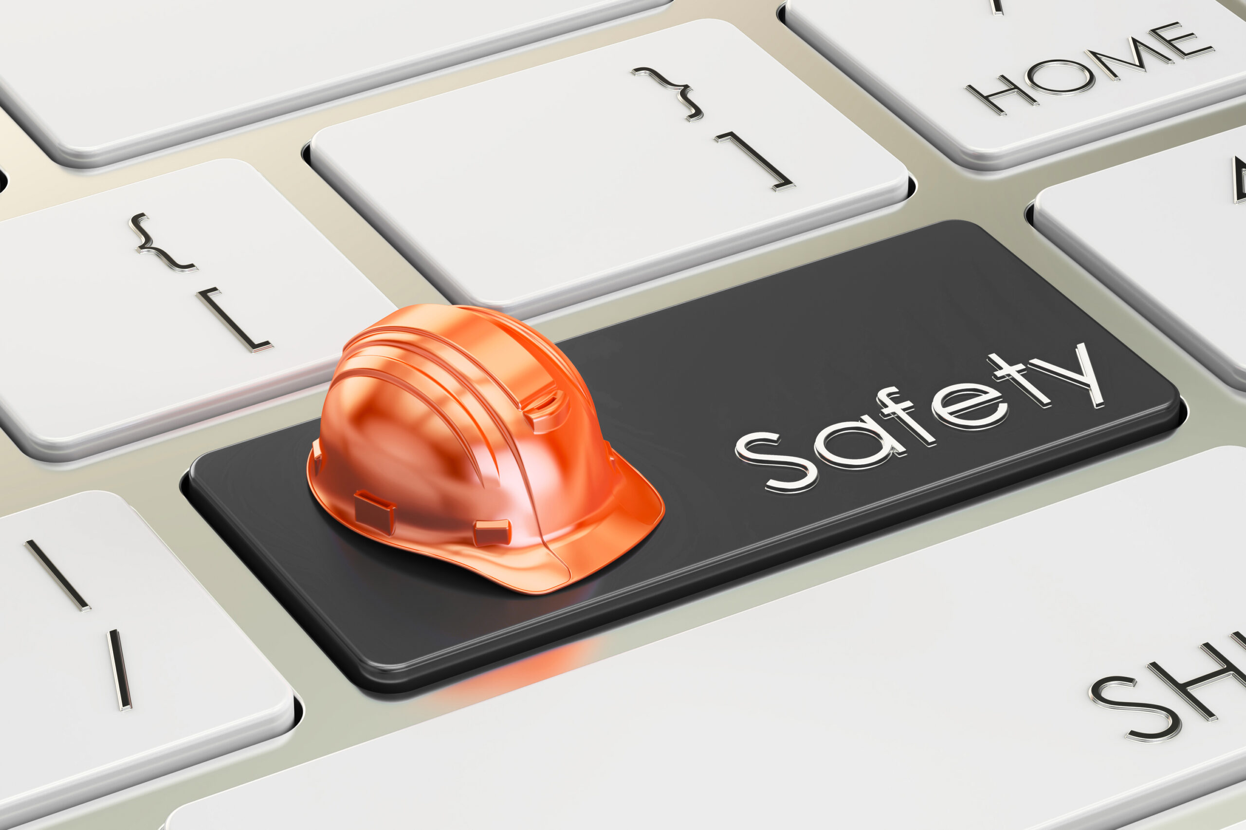 Hard hat on keyboard safety key.