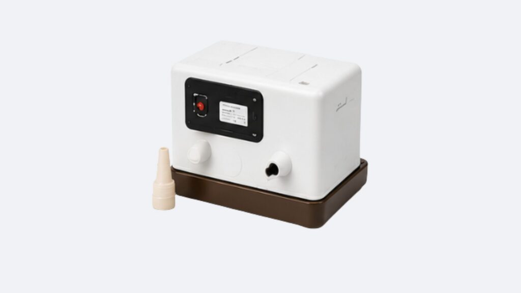 White condensate pump unit on brown base
